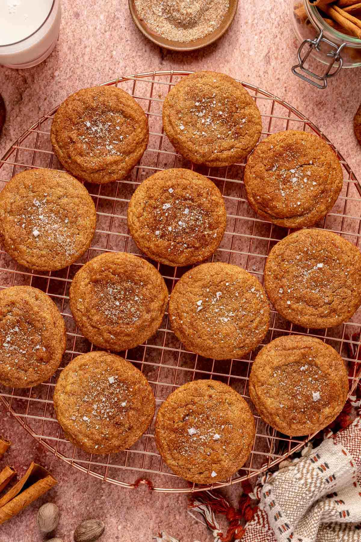 Cinnamon cookies cooling on a wire rack.