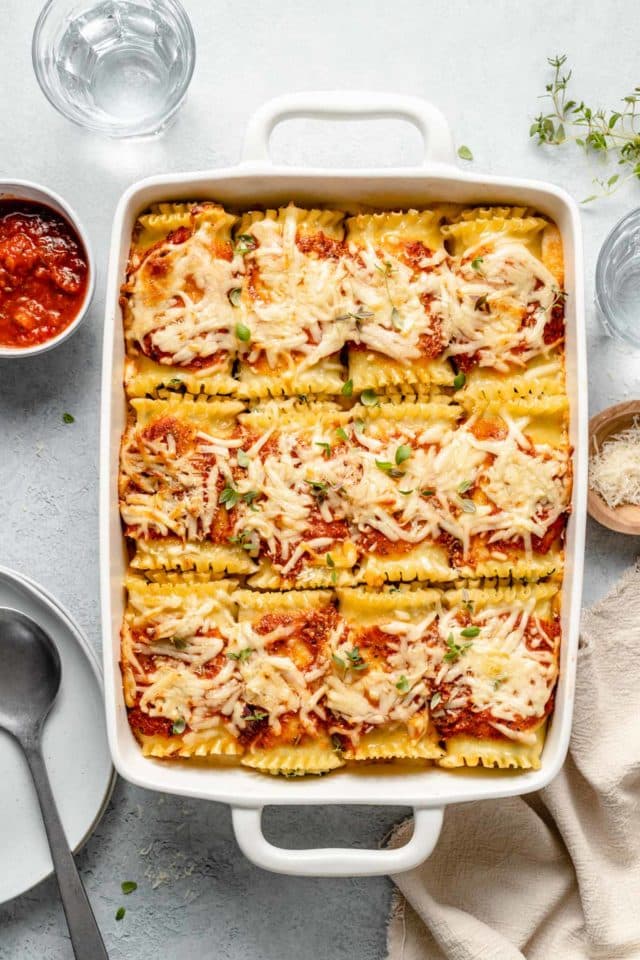 White casserole dish with lasagna roll ups.