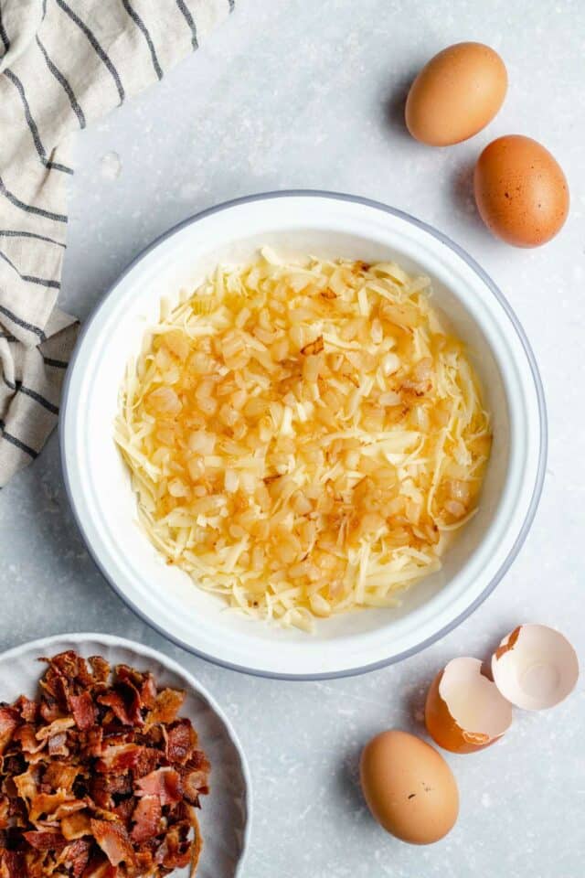 Hash browns on the bottom of a pie dish.