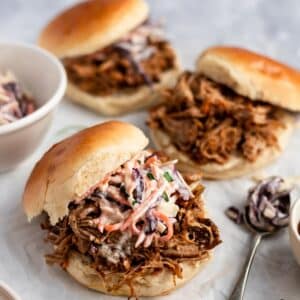 Slow cooker pulled pork sandwiches with coleslaw.