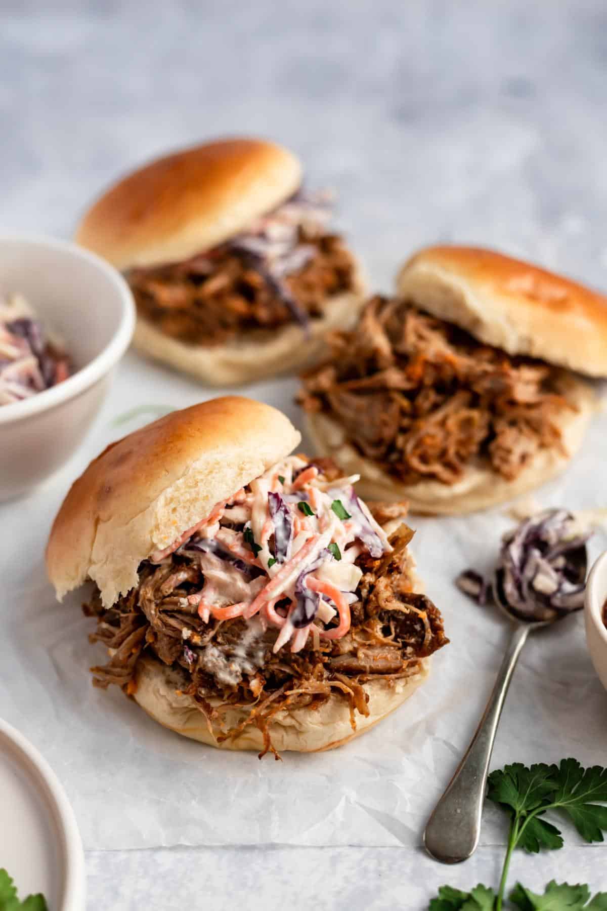 Slow cooker pulled pork sandwiches with coleslaw.