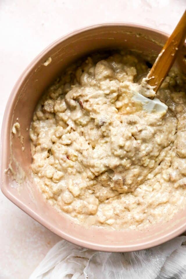 Stirring together the batter for apple bread.