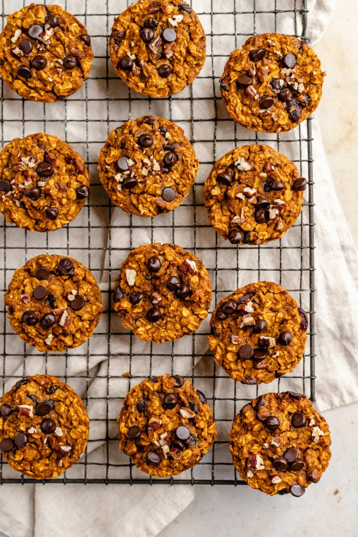 Pumpkin oatmeal muffins on a wire rack.