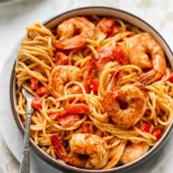 Creamy Cajun Shrimp Pasta in a bowl with pasta swirled around a fork.