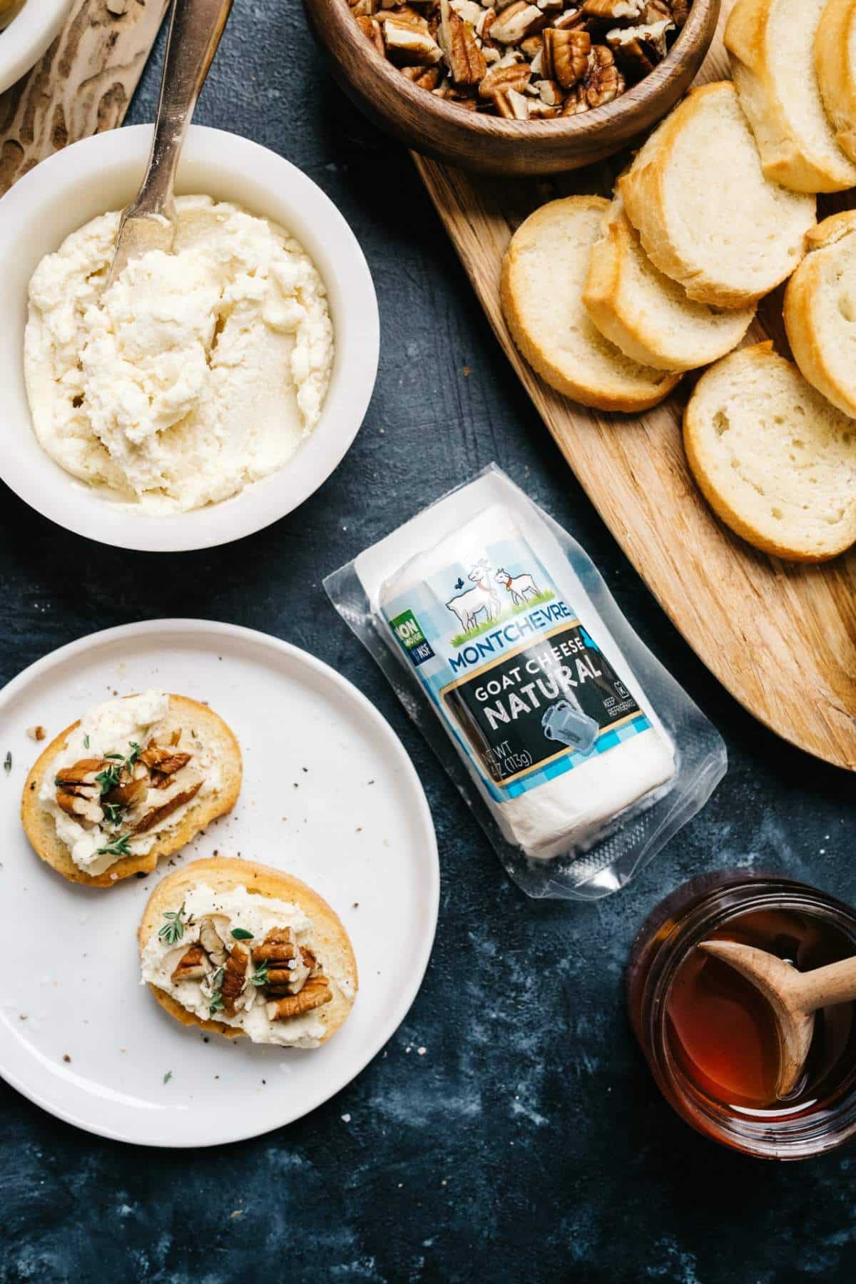 Spread bread with goat cheese and top with pecans and thyme.