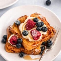 Brioche French toast topped with yogurt and berries.