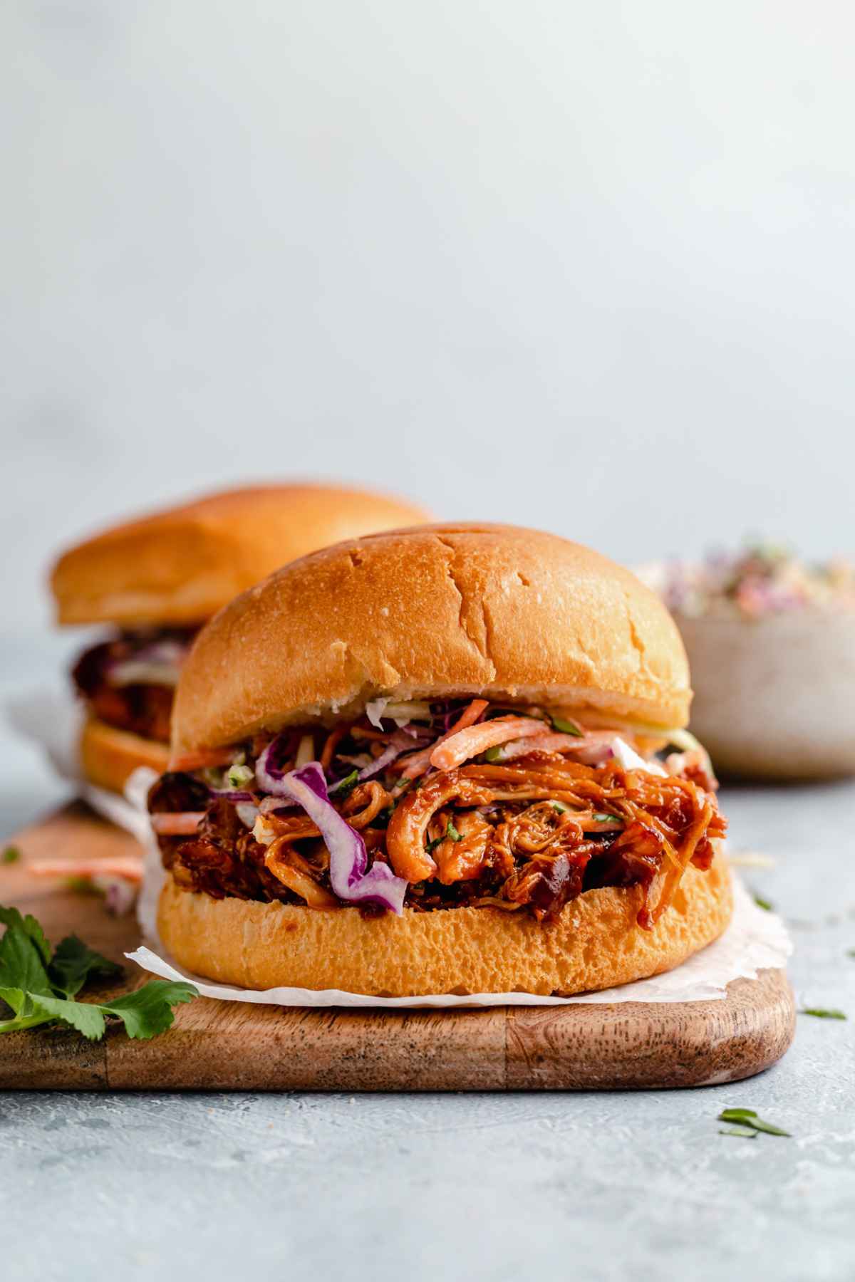 Pulled chicken on a bun with coleslaw.