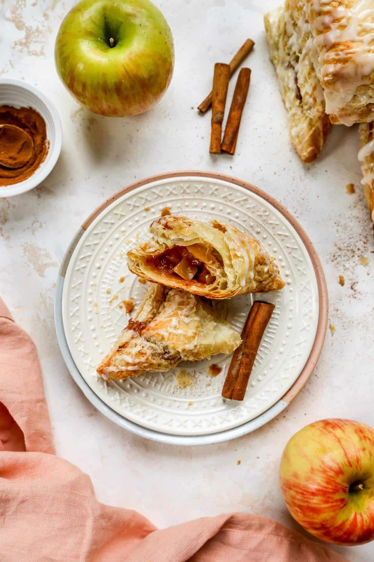 Pastries with apple filling on a white plate.