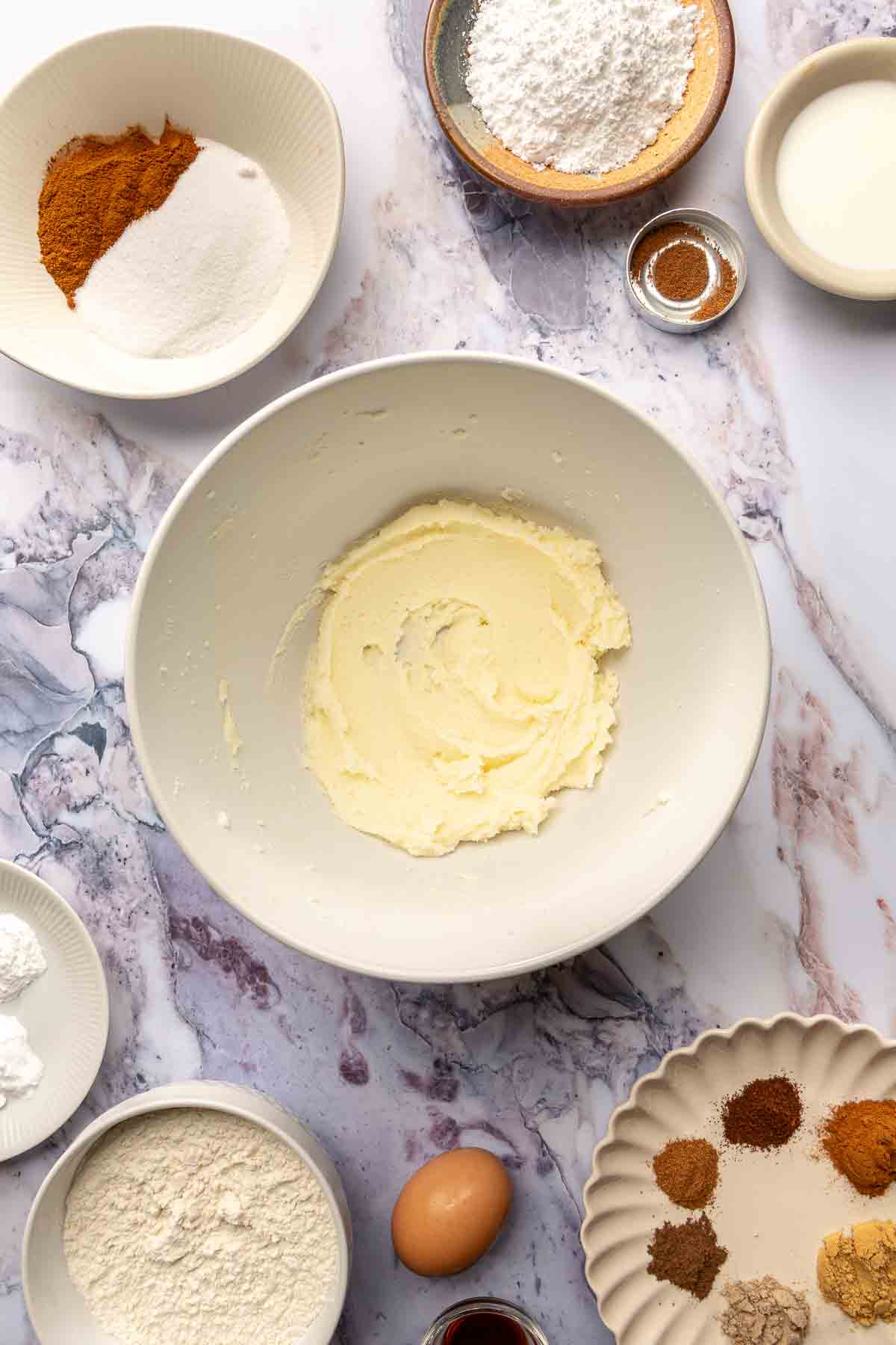 Beating sugar and butter in a large bowl.