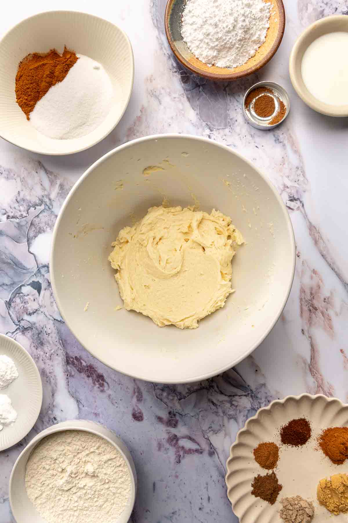 Egg, sugar and butter mixed in a bowl.