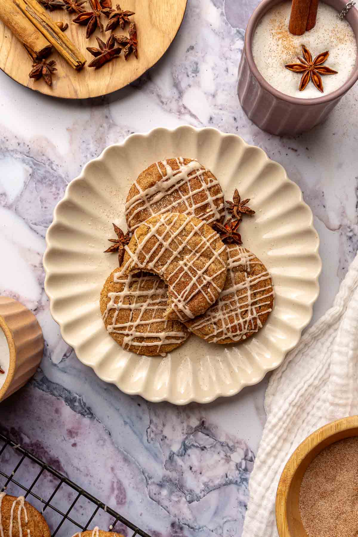 Taylor Swift chai cookies on a plate served with coffee.