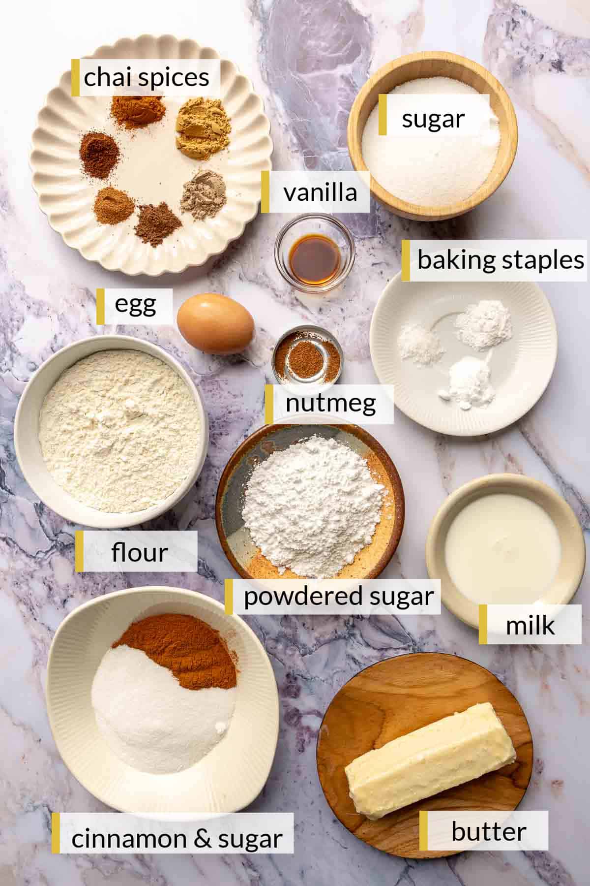 Ingredients for making cookies divided into small bowls.