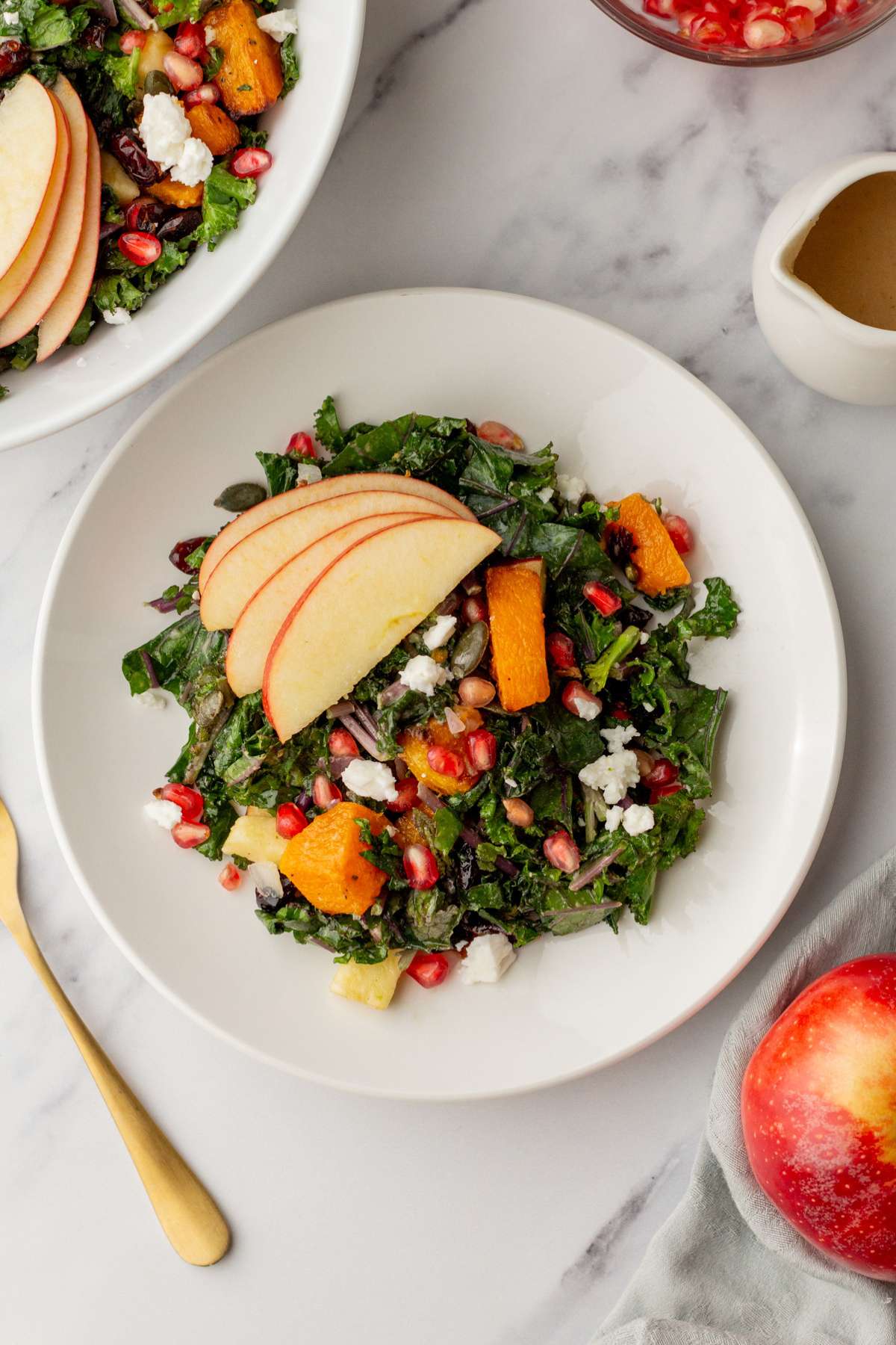 Butternut squash salad served on a white plate.