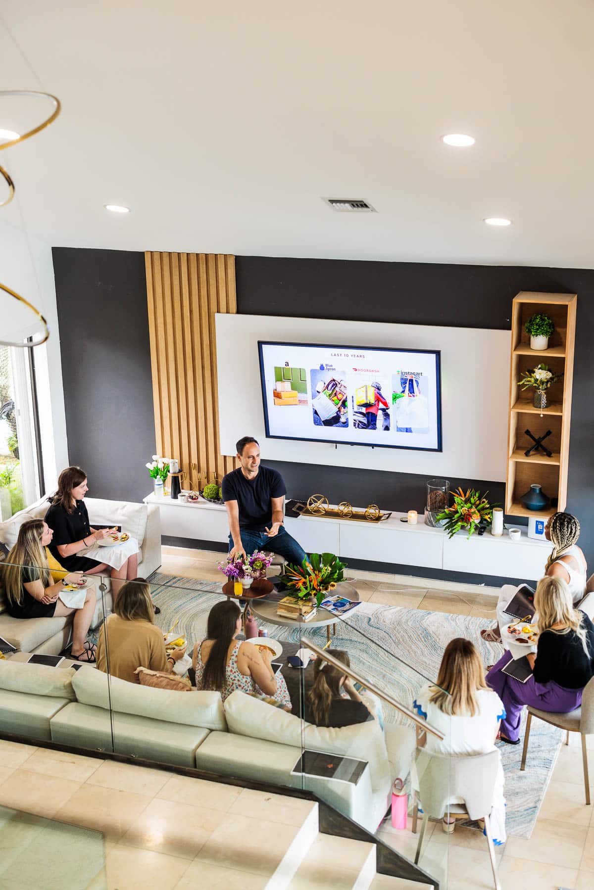 Group of people in a discussion in a living area.