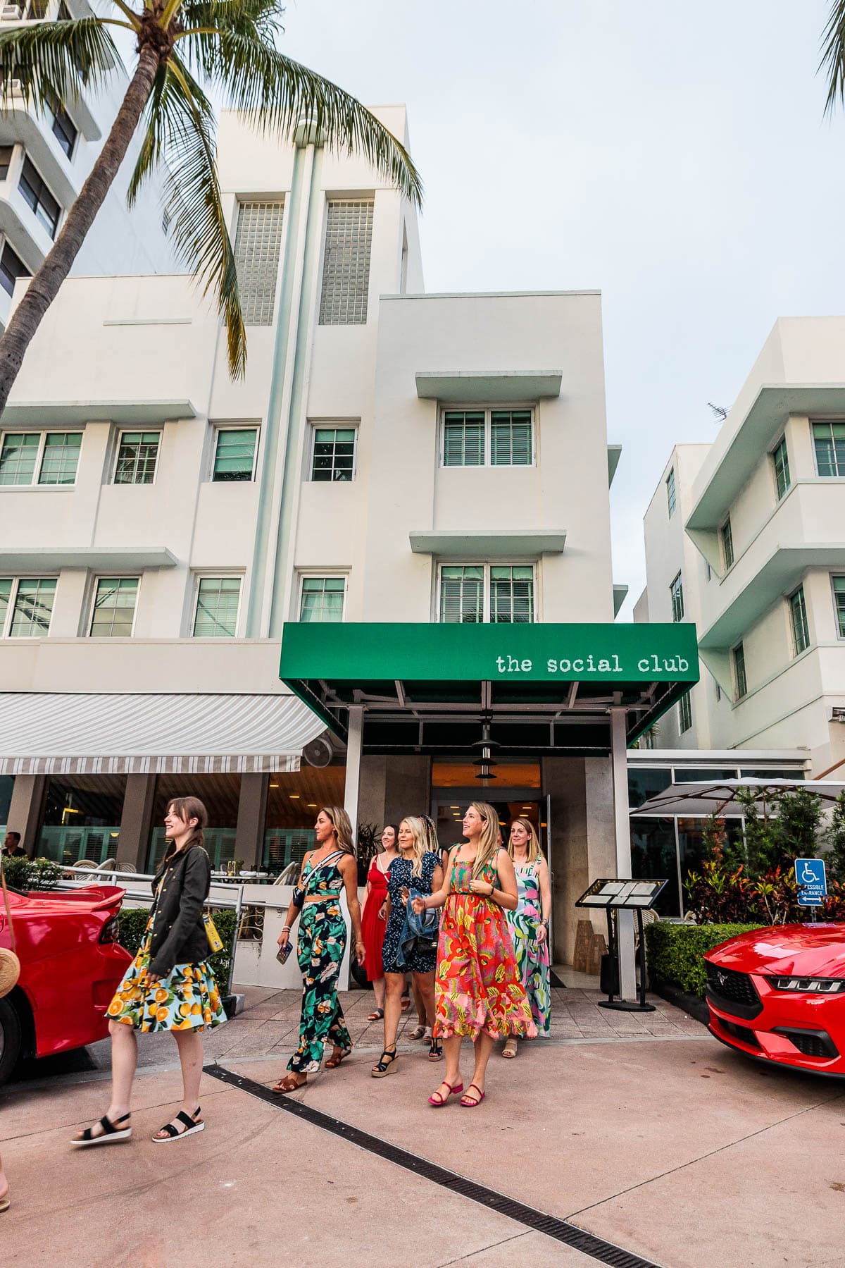 Group of women walking out of a restaurant. 