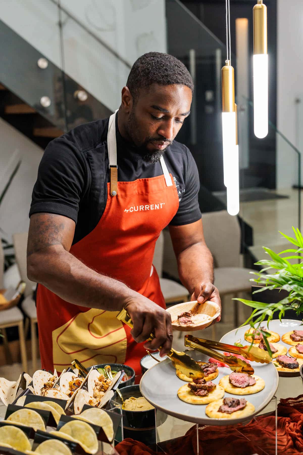 Chef preparing a taco bar.