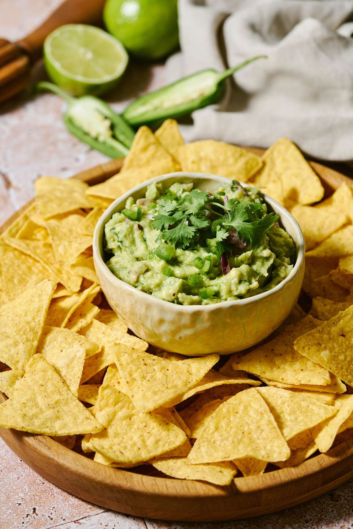 Guacamole served in a bowl with tortilla chips.