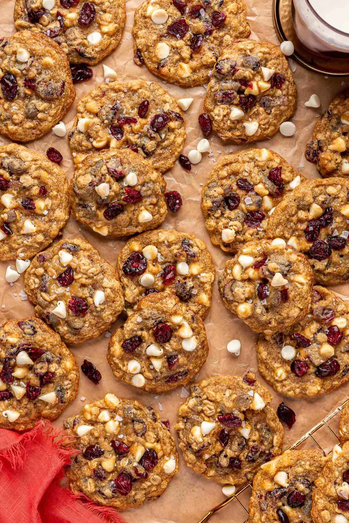 Cranberry oatmeal cookies on parchment paper.