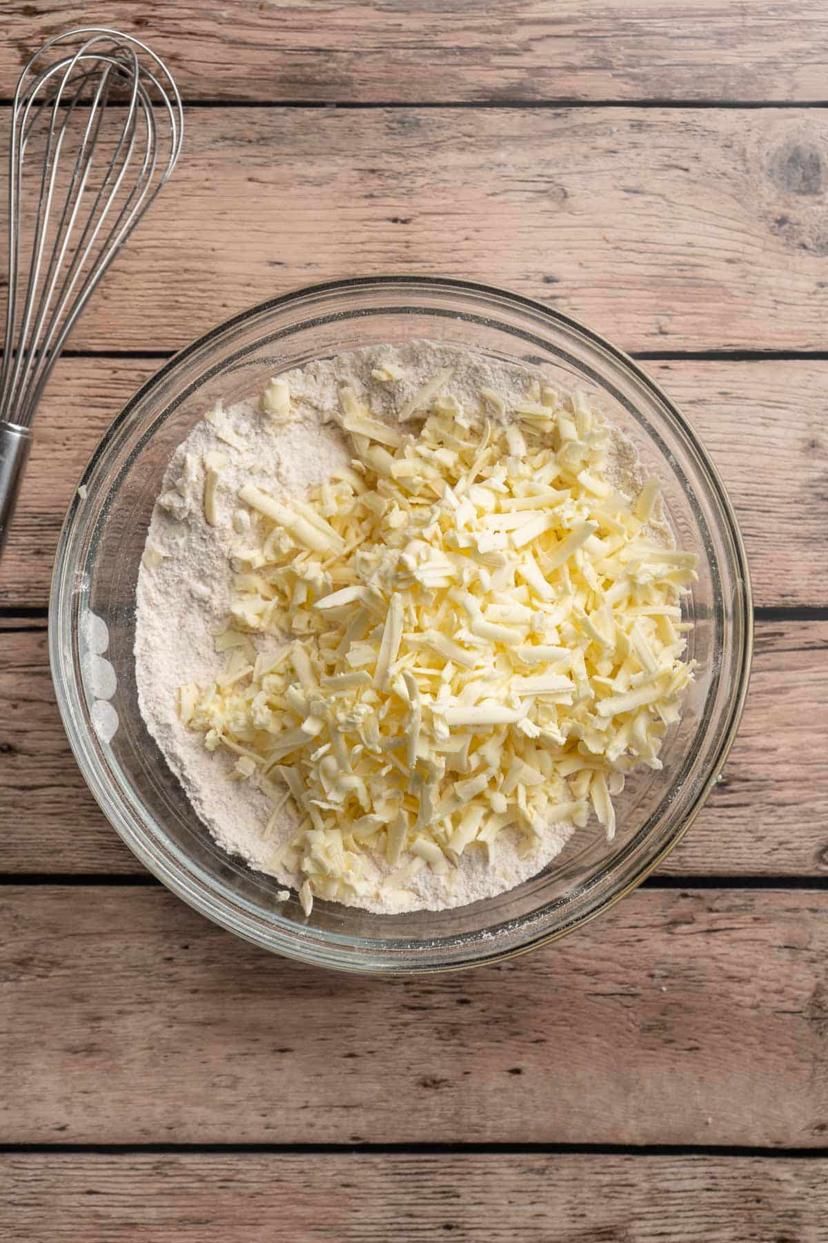 Grate frozen butter into the flour mixture.