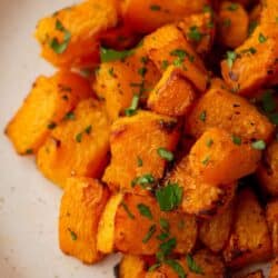 Air fryer butternut squash on a white plate.