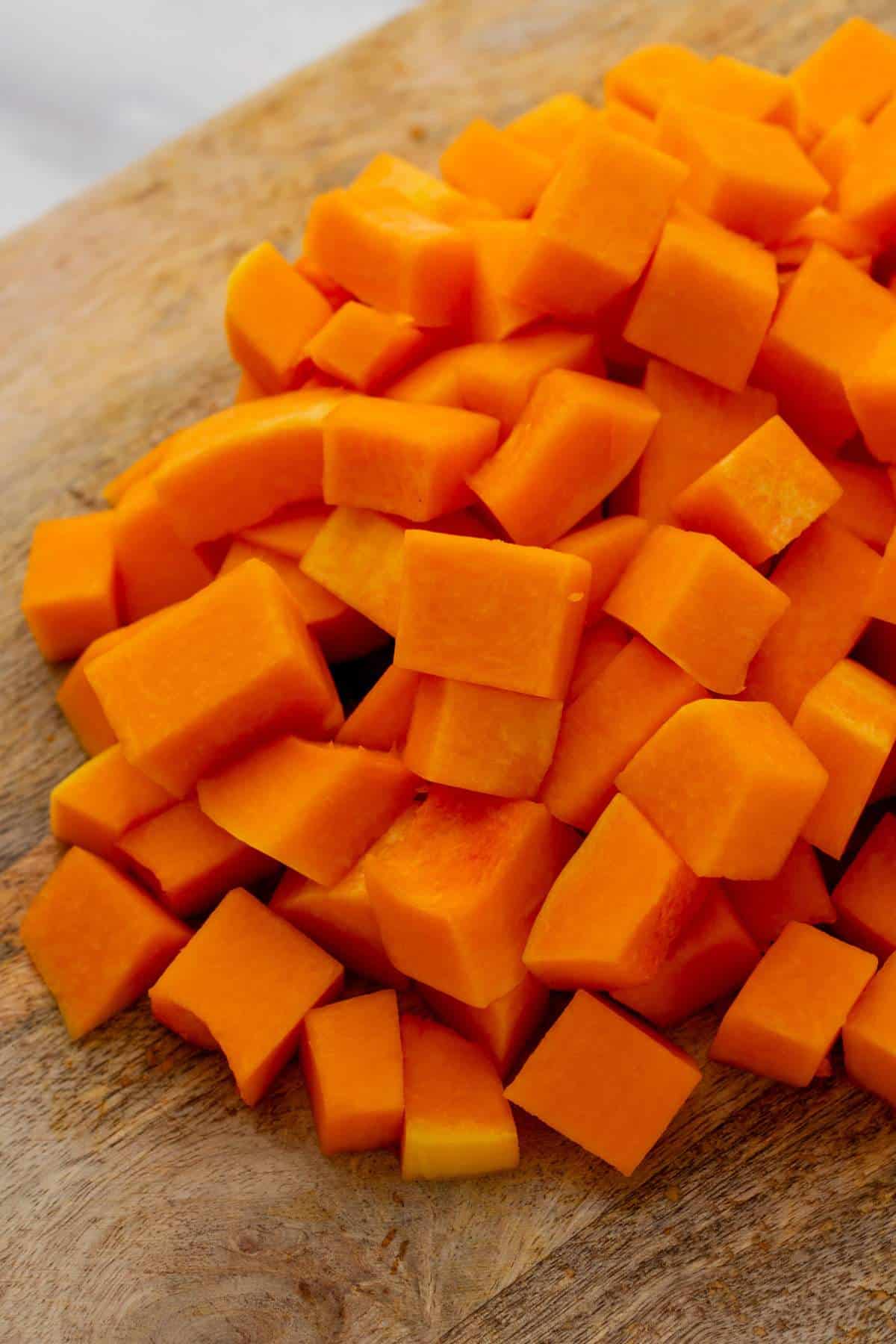 Cubed butternut squash on a cutting board.