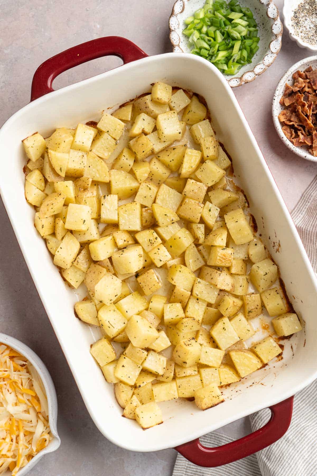 Roasted potato chunks in a casserole dish.