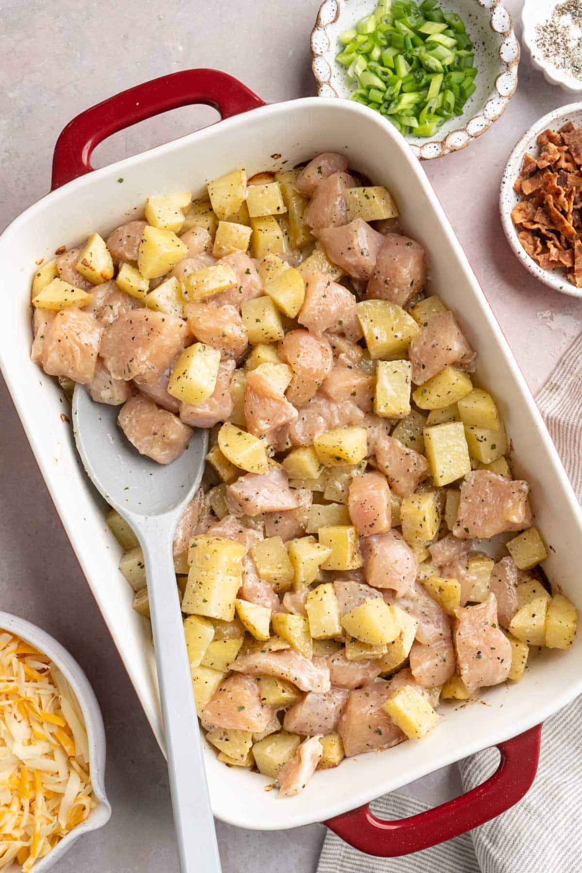 Stirring chicken with roasted potatoes.