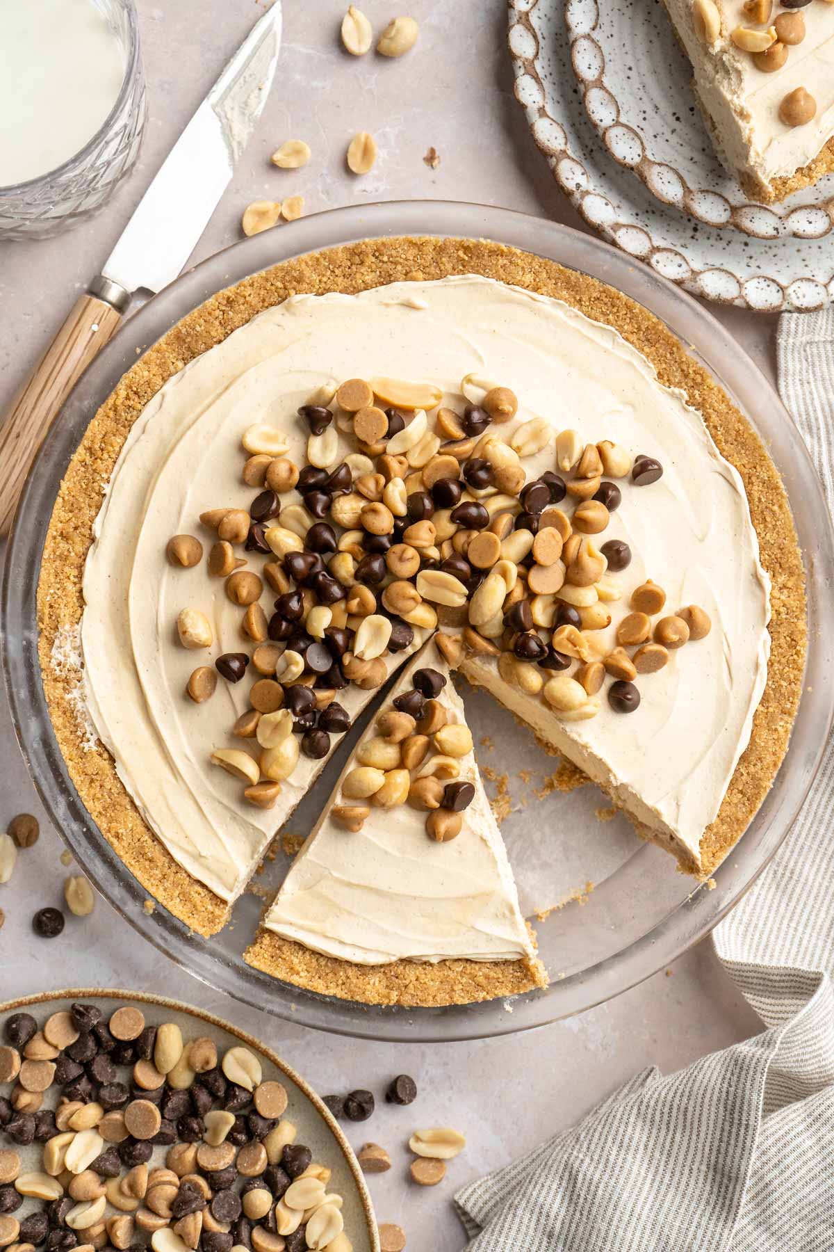 No bake peanut butter pie topped with peanuts, peanut butter chips and chocolate chips.