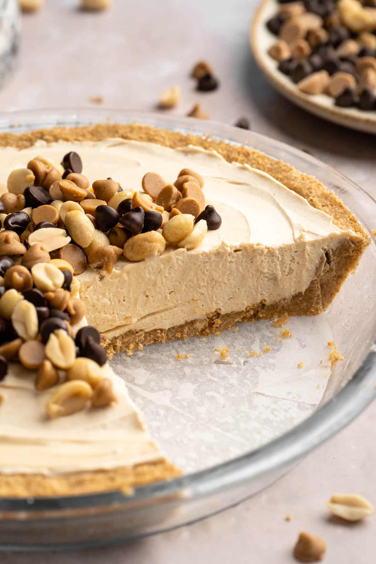 Sliced peanut butter pie in a pie dish.