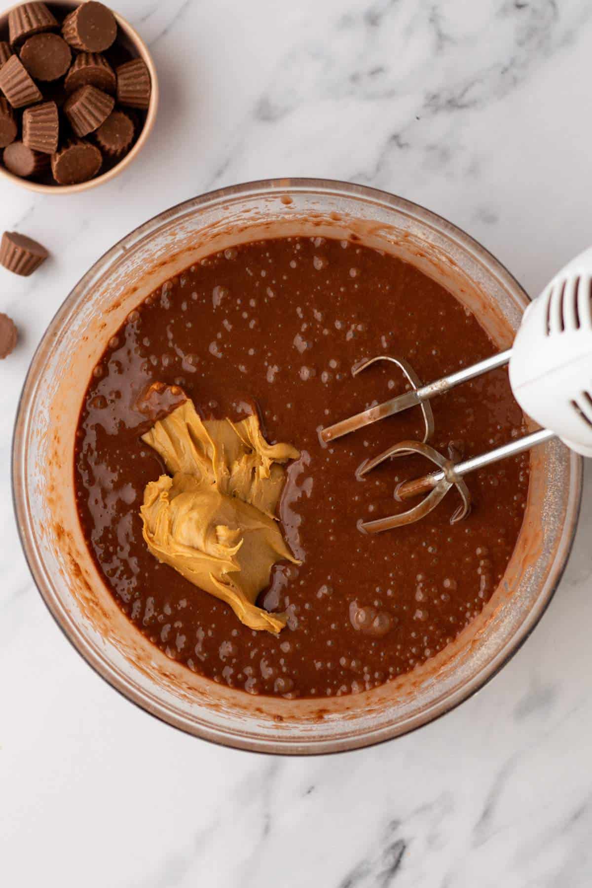 Mix the chocolate cake mix with peanut butter using a hand mixer.